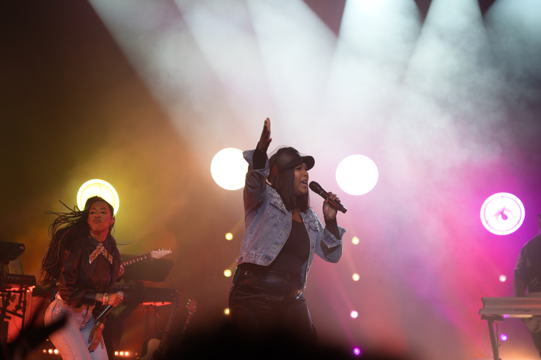 Vocalist performing under stage lights