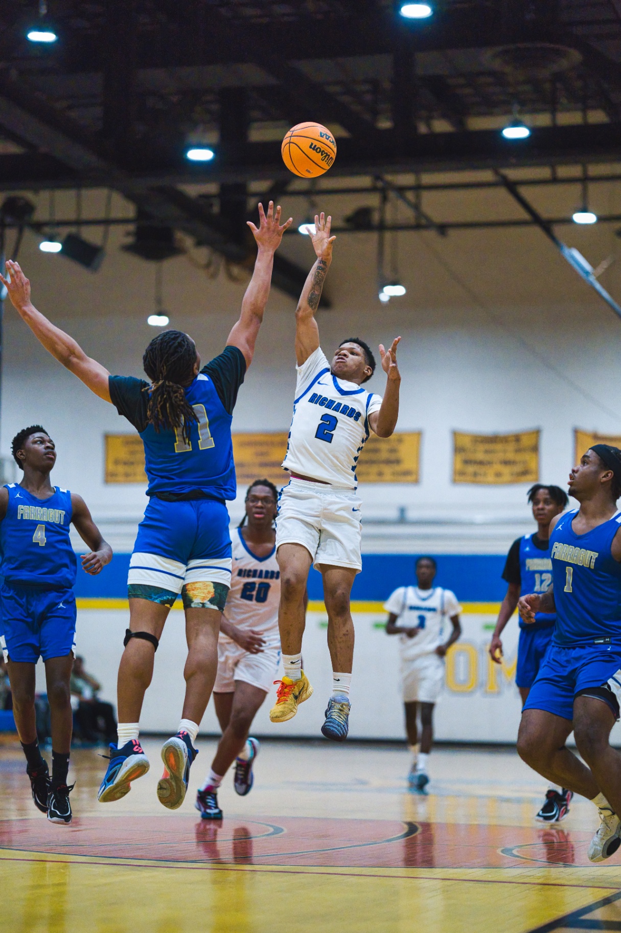 High school basketball player rising for a jumpshot